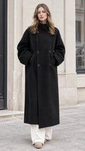 Front full view of woman wearing Black double-breasted high neck maxi overcoat with wide-leg white pants