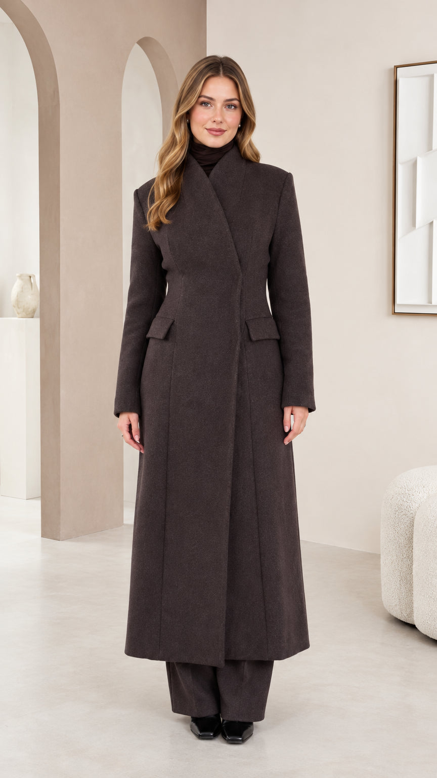 Full front view of model wearing charcoal tailored high-neck maxi coat