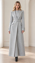 Front full view of woman wearing Light Grey belted maxi overcoat