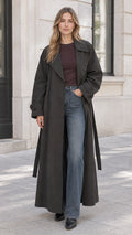 Front full-length view of woman wearing charcoal maxi trench coat with open front and tie belt