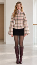 Front full view of woman wearing pink plaid high-neck jacket with bell sleeves and button front