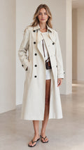 Front full view of woman wearing beige double-breasted long trench coat