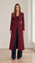 Full front view of model wearing burgundy maxi tailored blazer coat with wide-leg jeans