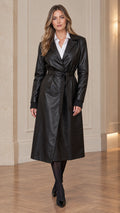Front full-length view of model wearing black belted faux leather trench coat