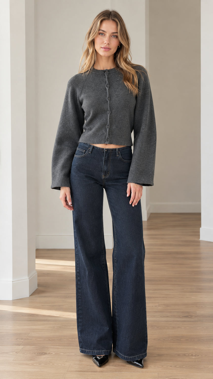 Front full view of model wearing charcoal grey cropped button-up knit cardigan with wide leg jeans