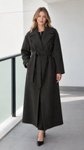 Front view of model wearing a full-length dark grey belted maxi wrap coat