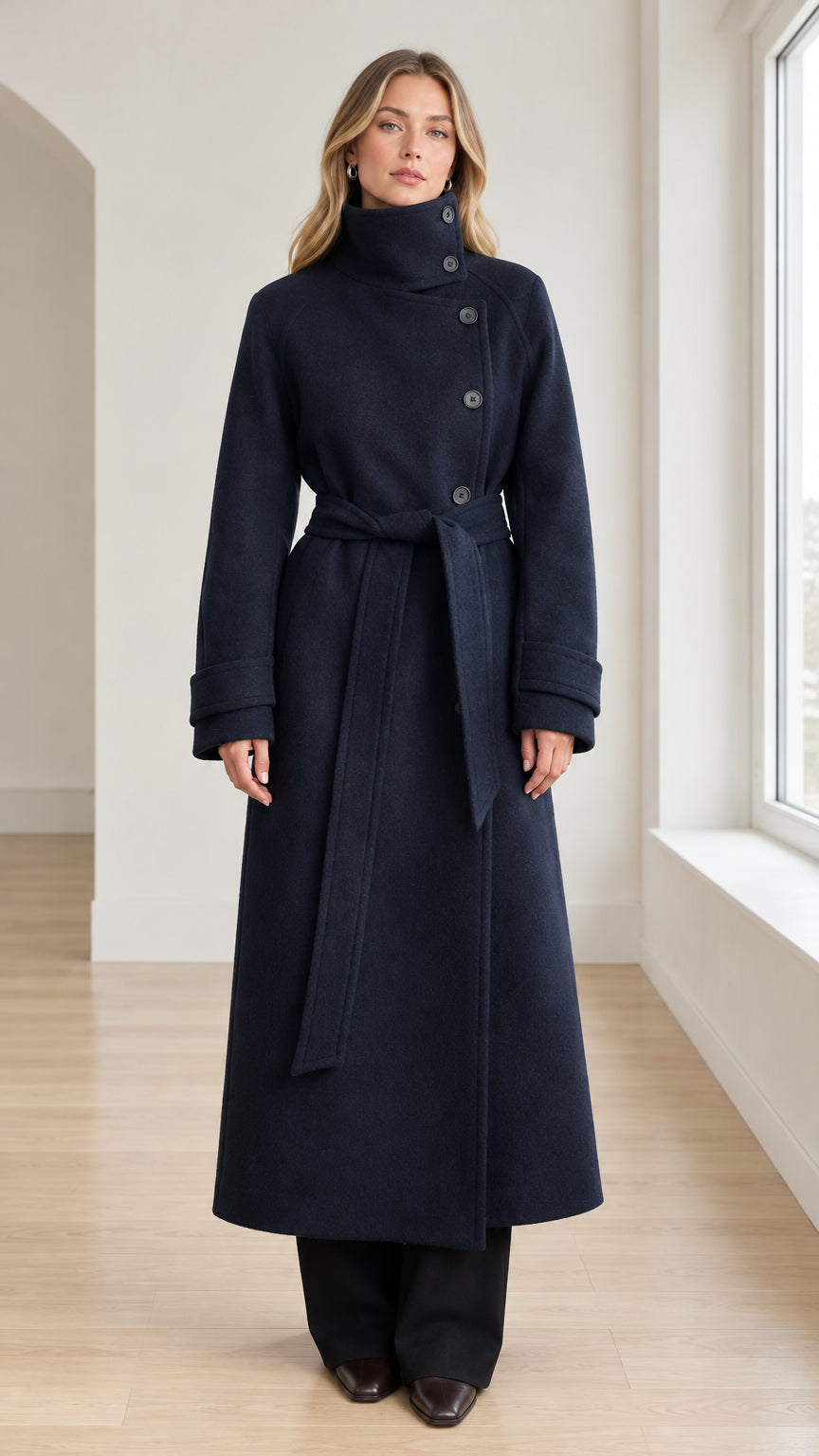 Front view of model wearing Navy Blue high neck belted maxi overcoat
