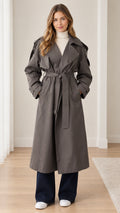 Front view of model wearing dark grey longline belted trench coat