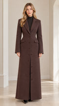 Front full-length view of woman wearing brown tailored maxi overcoat