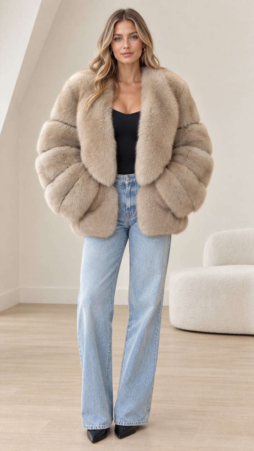 Front view of model wearing taupe plush faux fur paneled jacket with light blue wide-leg jeans
