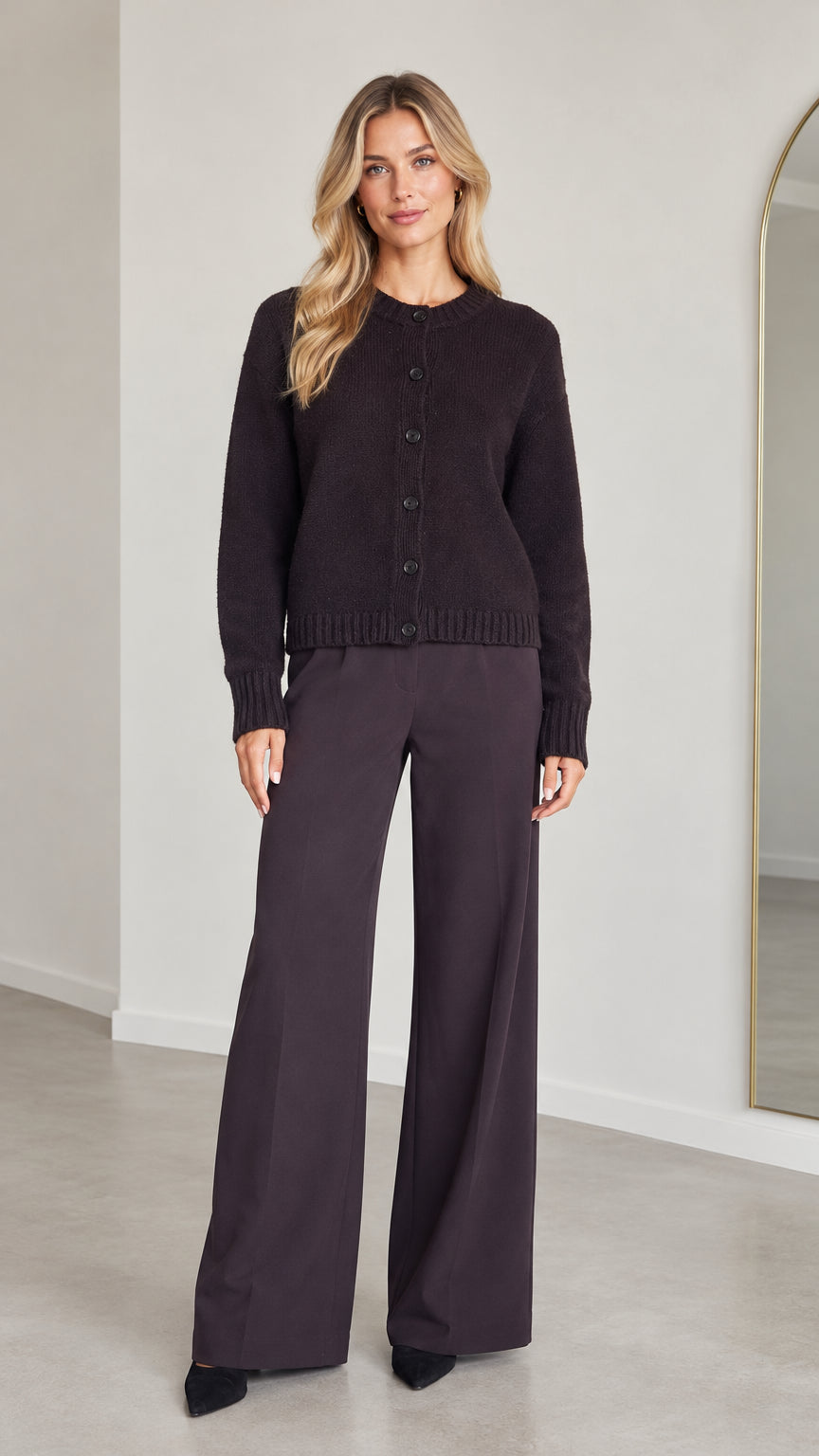 Front full view of model wearing Dark Plum knit button-down cardigan and matching wide-leg trousers