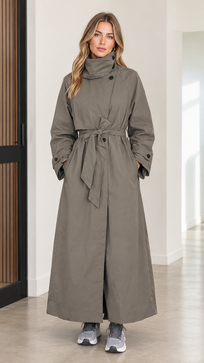 Full front view of women's olive green maxi trench coat with high collar and tie belt