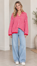 Front full-length view of woman wearing red and white striped collared cardigan sweater with wide-leg jeans