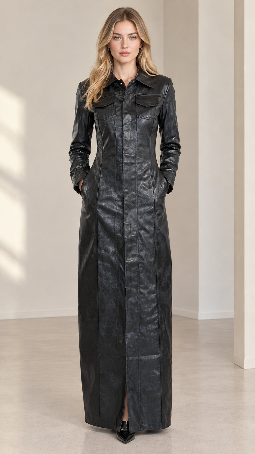 Front full-length view of model wearing black faux leather maxi shirt dress with pointed collar and pockets