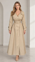 Full front view of women's beige maxi trench coat with wide lapel collar and belted waist