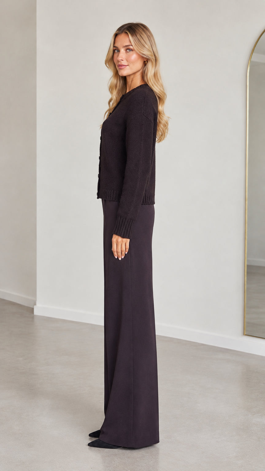 Side profile view of model wearing Dark Plum cardigan and wide-leg pant set