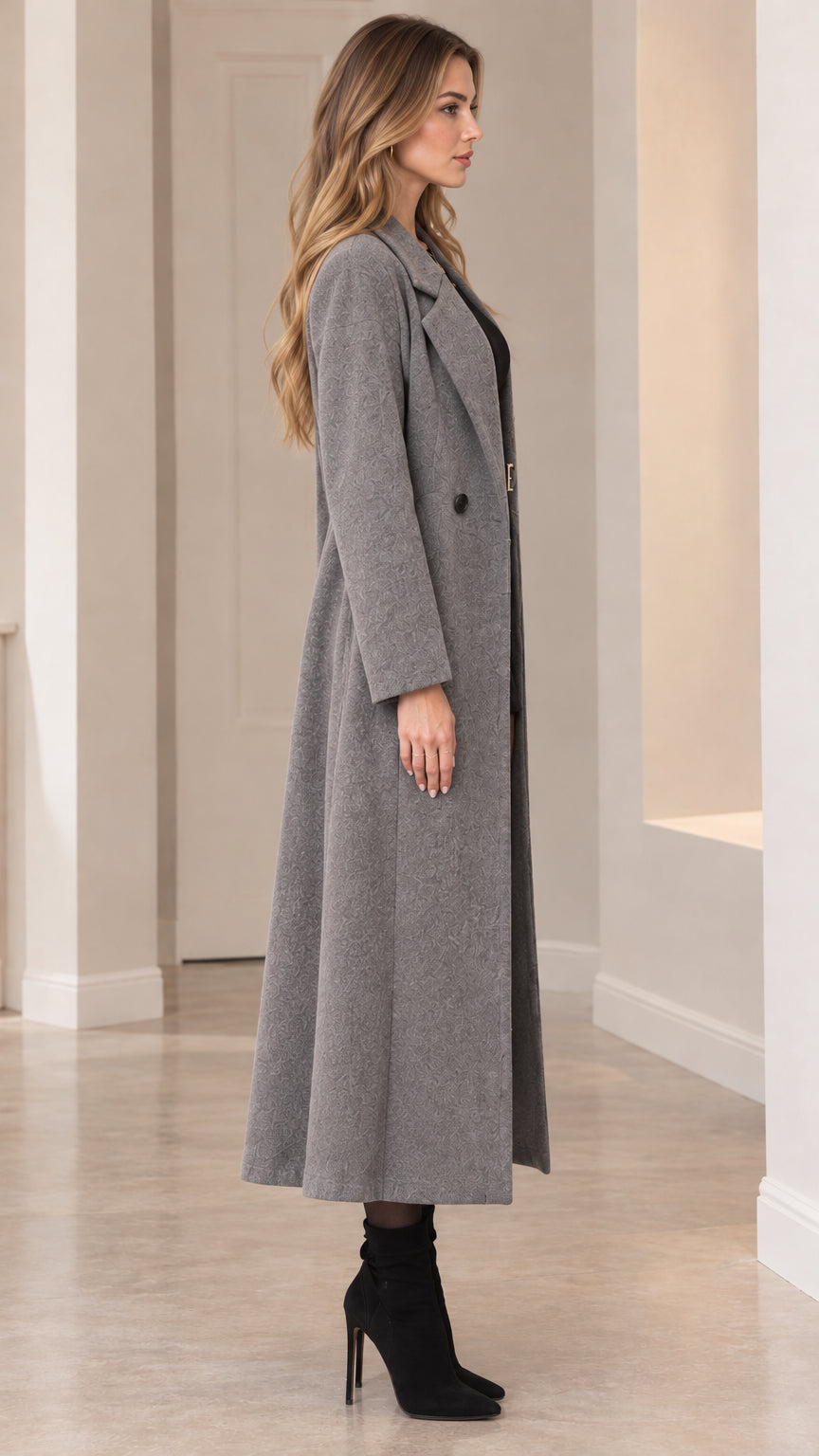 Side profile view of grey longline coat showing full maxi drape