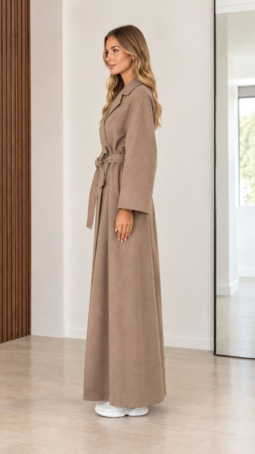 Side profile of women's taupe long wrap coat showing length and drape