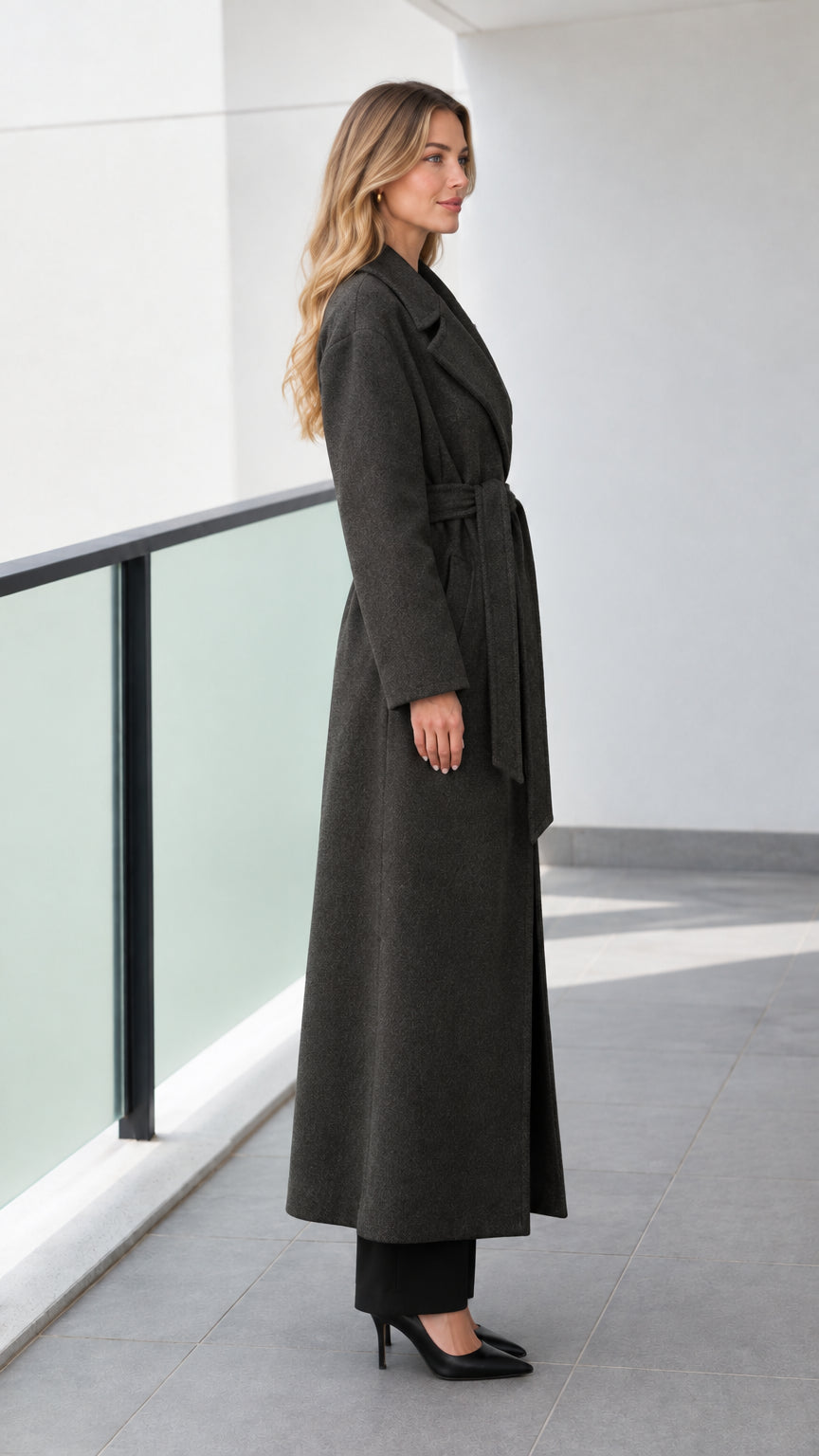 Side angle view of model in a charcoal grey longline trench wrap coat