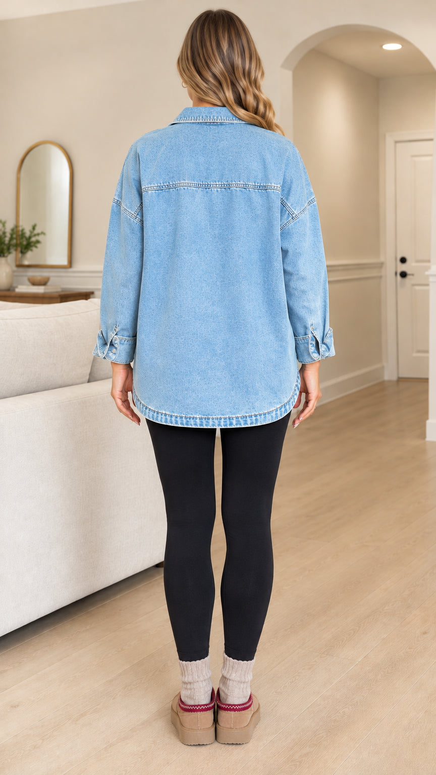 Back view of the oversized light blue denim shirt jacket with drop shoulders