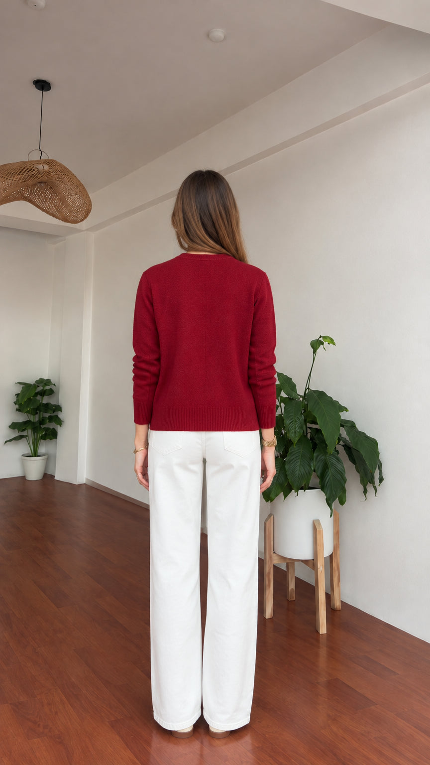 Back view of model wearing burgundy long sleeve cardigan sweater