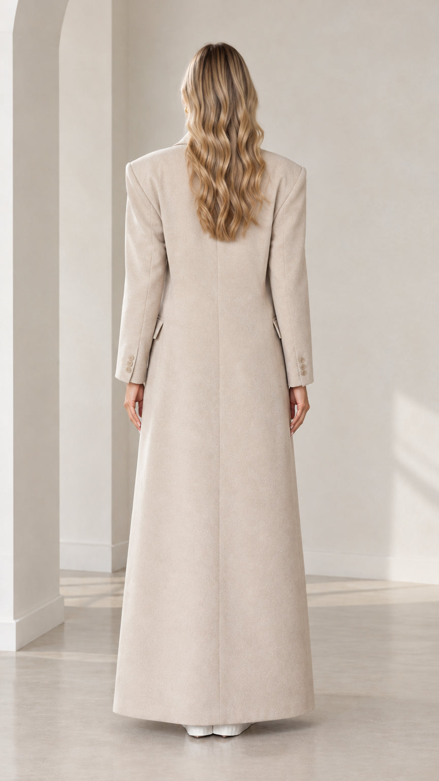 Back view of beige structured floor-length overcoat