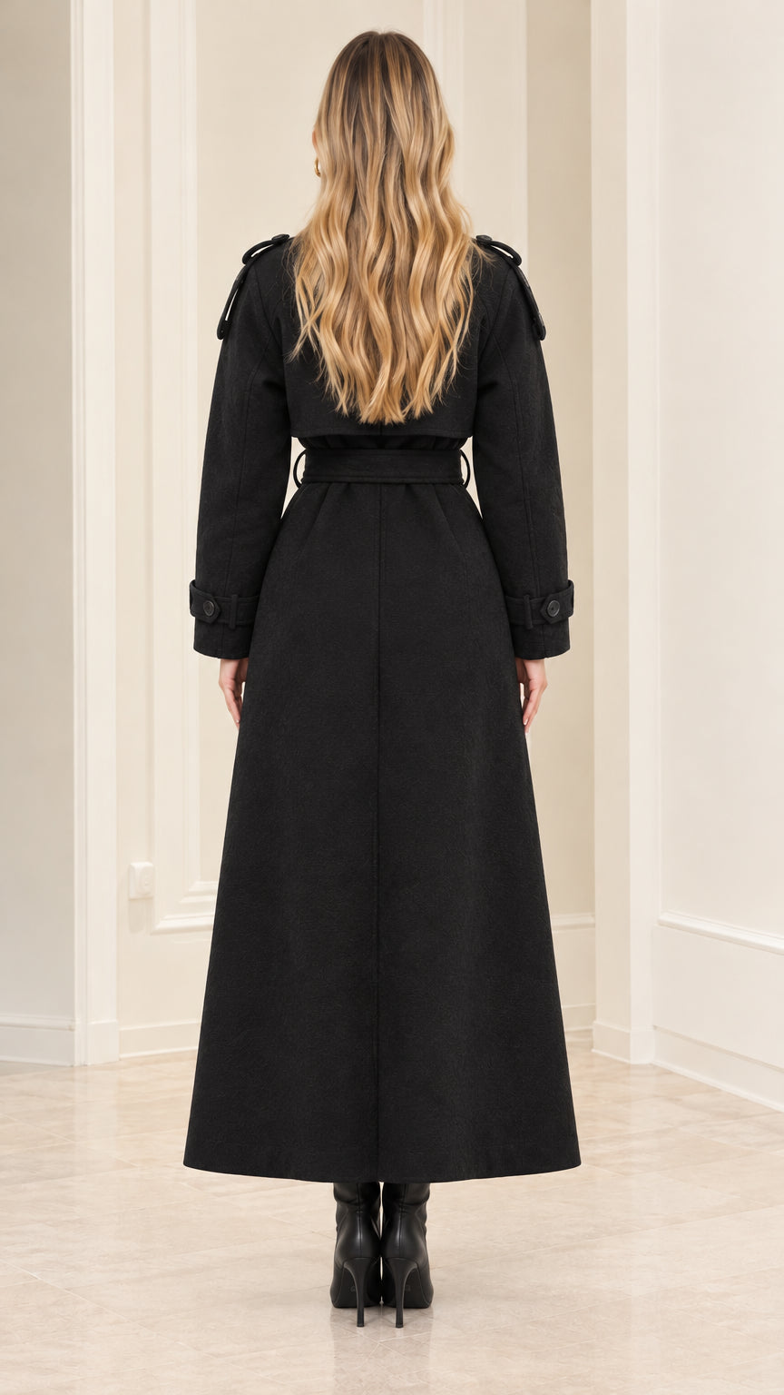 Back view of woman wearing Black maxi trench coat showing full-length drape