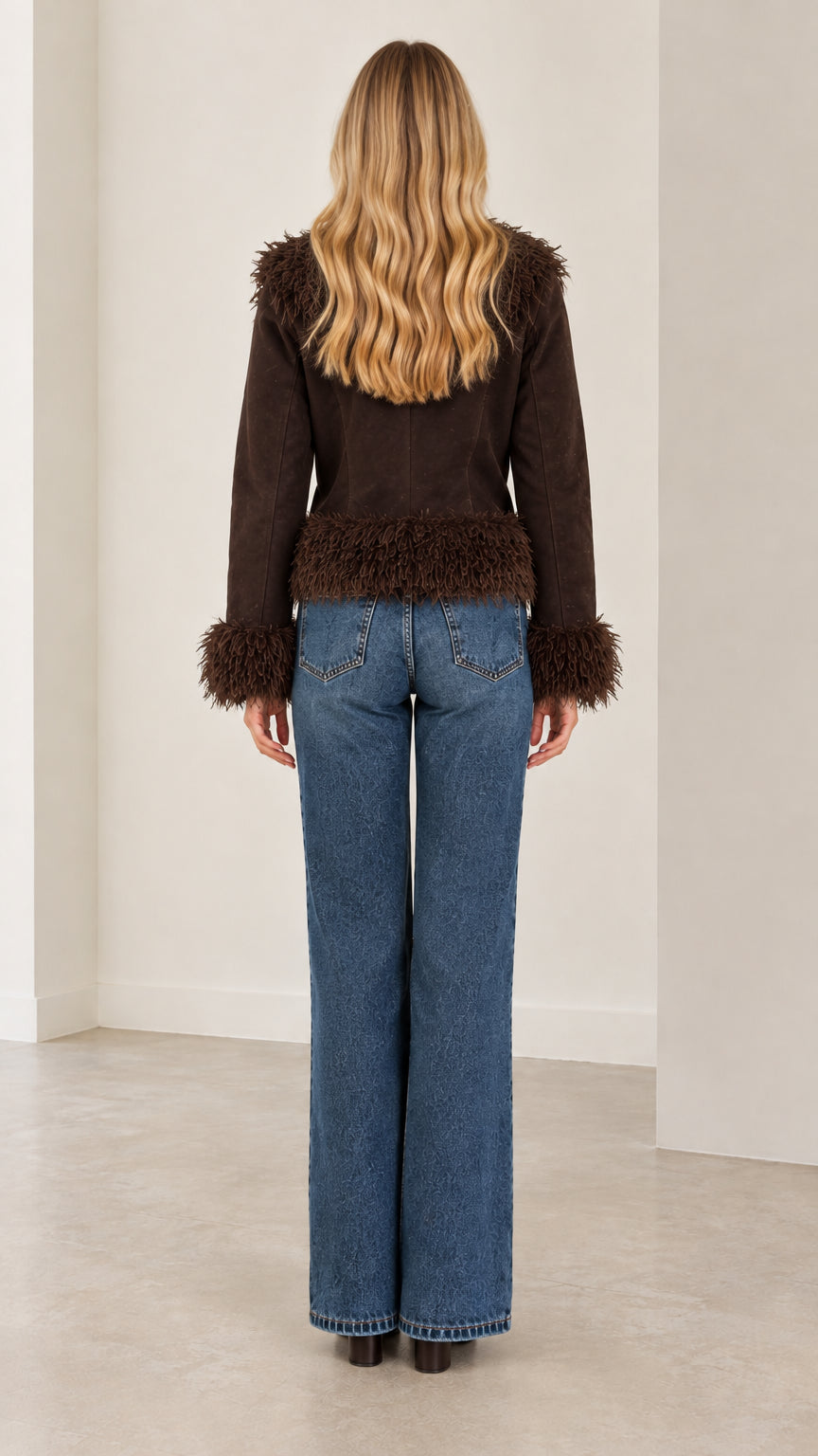 Back view of the brown faux suede jacket highlighting the tailored fit and shaggy hemline