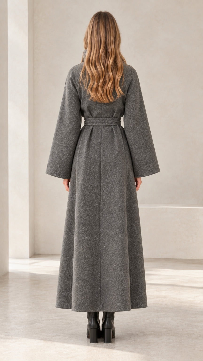 Back view of women's charcoal grey belted maxi coat with elegant structured silhouette