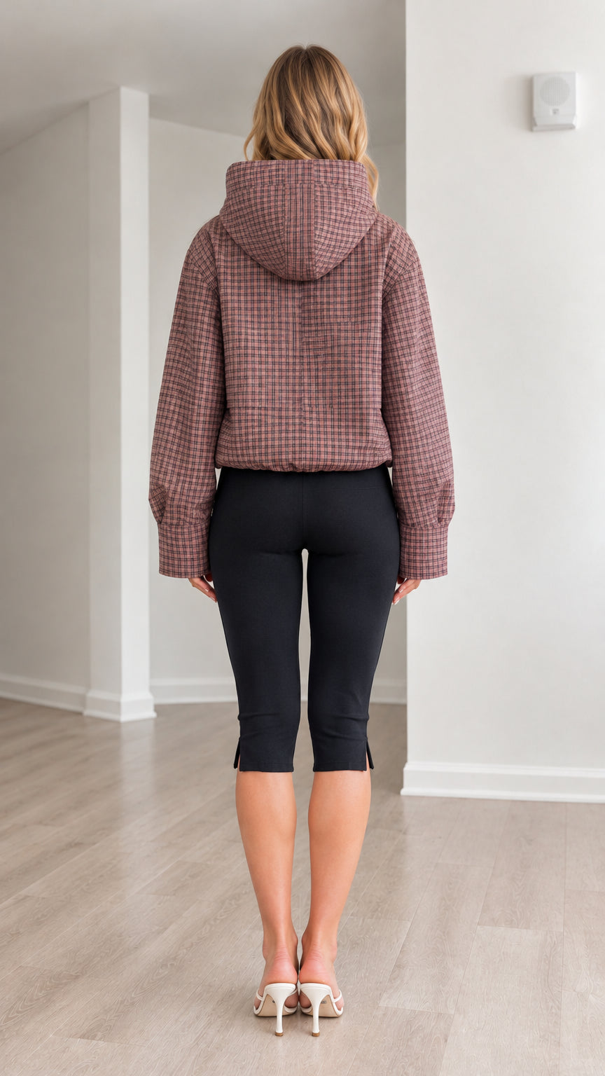 Back full-length view of model wearing dusty rose plaid hooded jacket highlighting hood and back fit