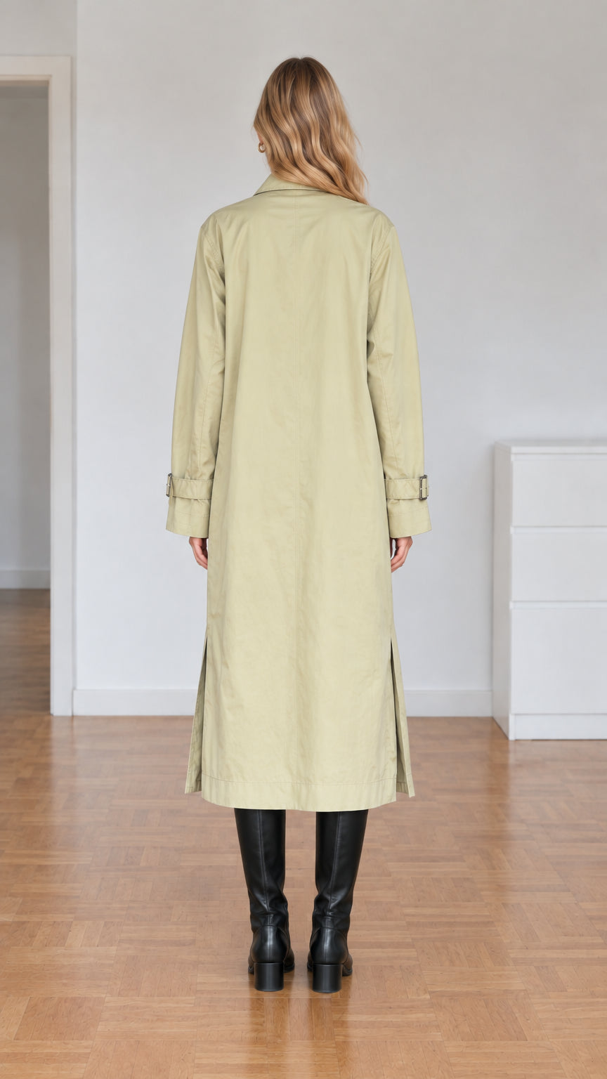 Back view of model wearing sage green long duster trench coat