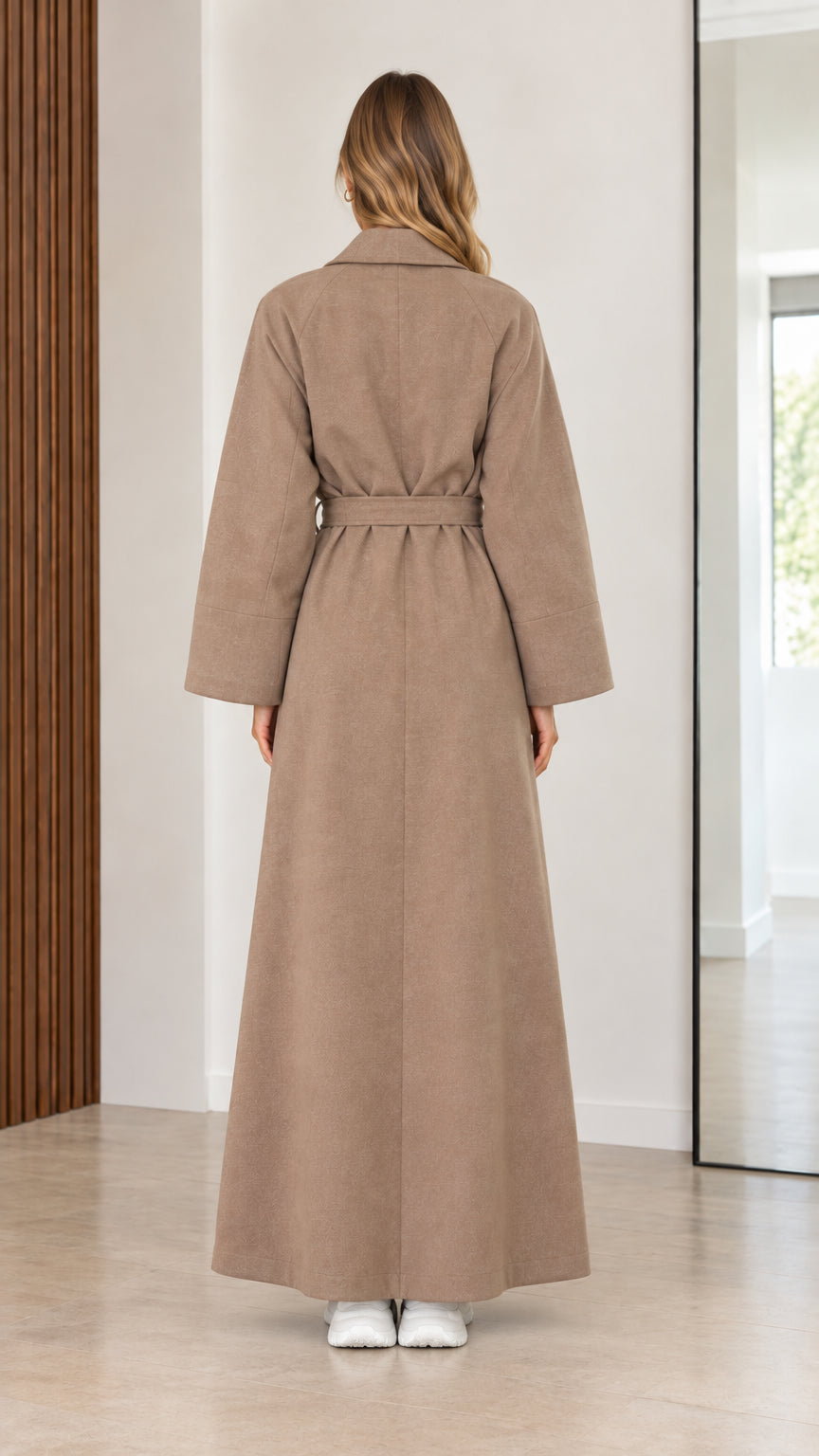 Back view of women's taupe full length overcoat with center vent