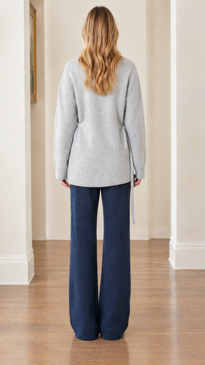 Back full view of woman wearing Light Gray relaxed fit knit sweater