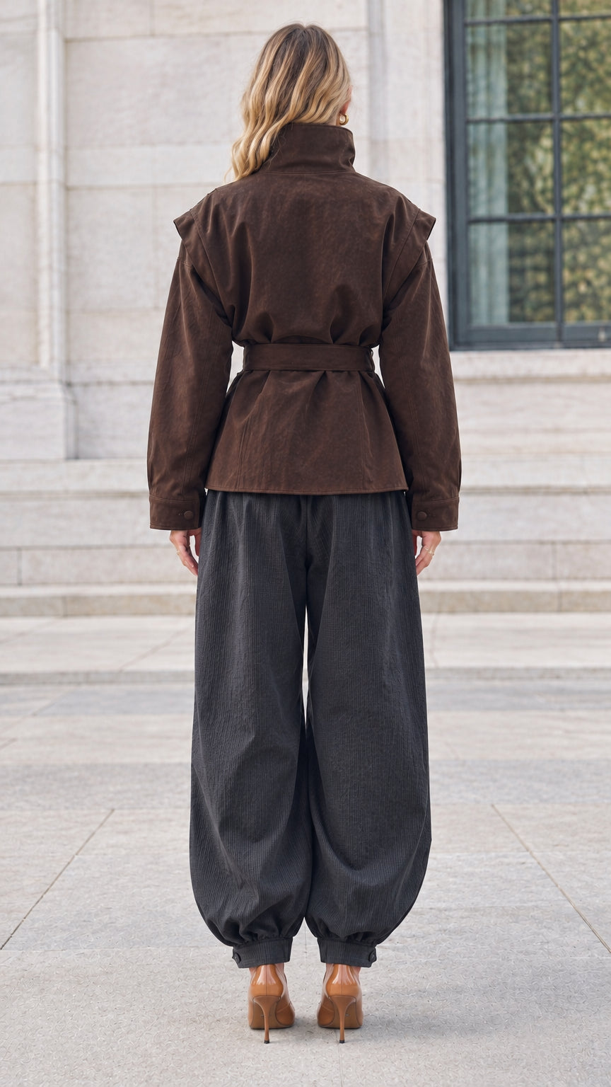 Back view of brown belted stand collar utility jacket showing clean tailored line