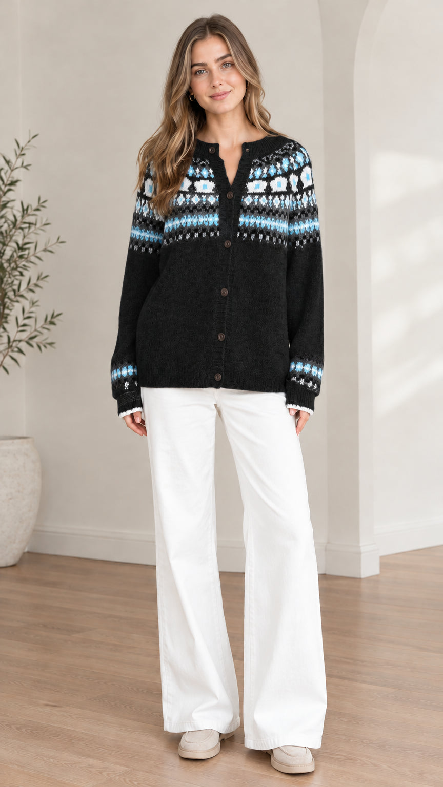 Front view of model wearing a black Fair Isle button-down knit cardigan sweater