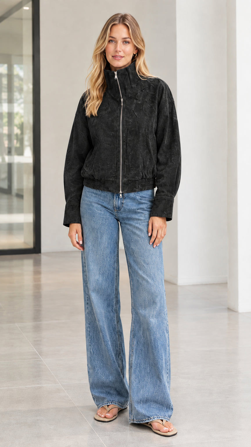 Woman wearing black textured corduroy stand collar zip bomber jacket