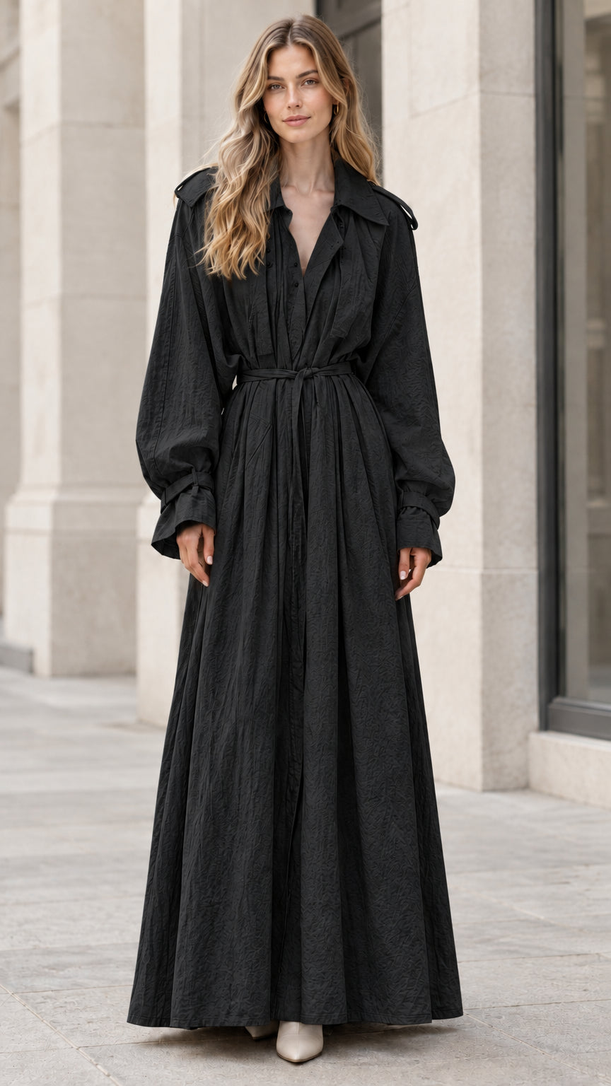 Model wearing the long sleeve belted trench maxi dress in classic black