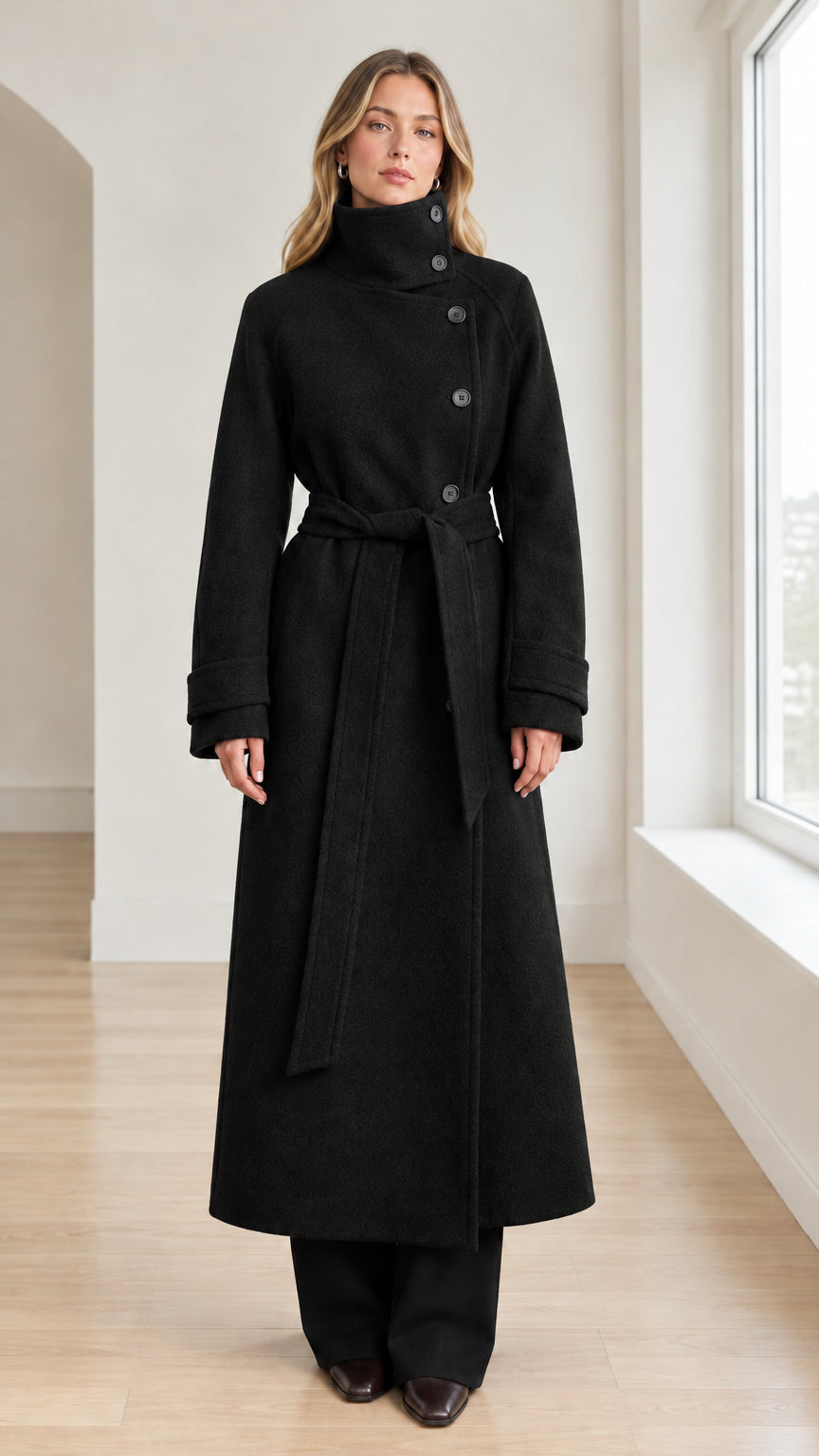 Front view of model wearing Black high neck belted maxi overcoat