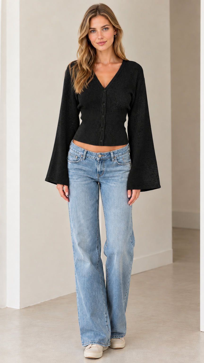 Full front view of model wearing black V-neck bell sleeve knit cardigan