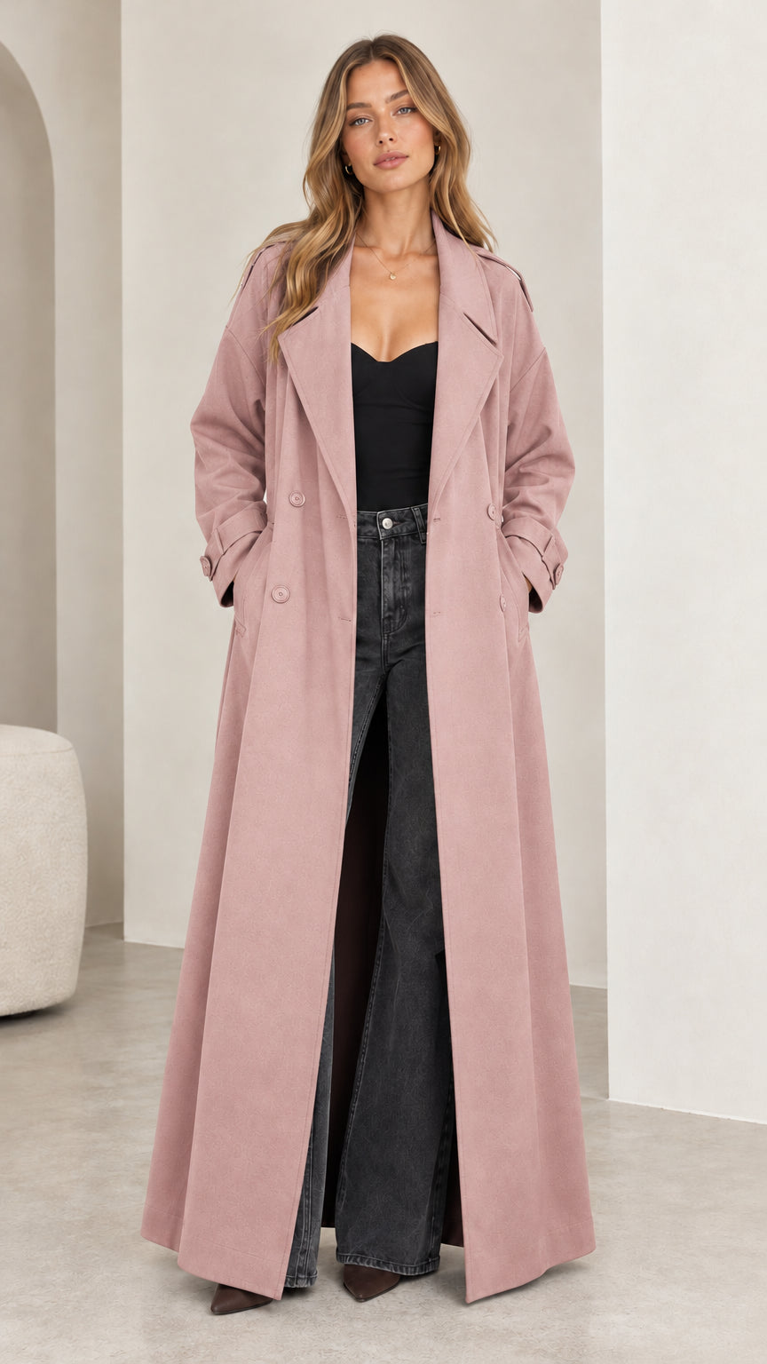 Full front view of model wearing the floor-length dusty pink double-breasted trench coat