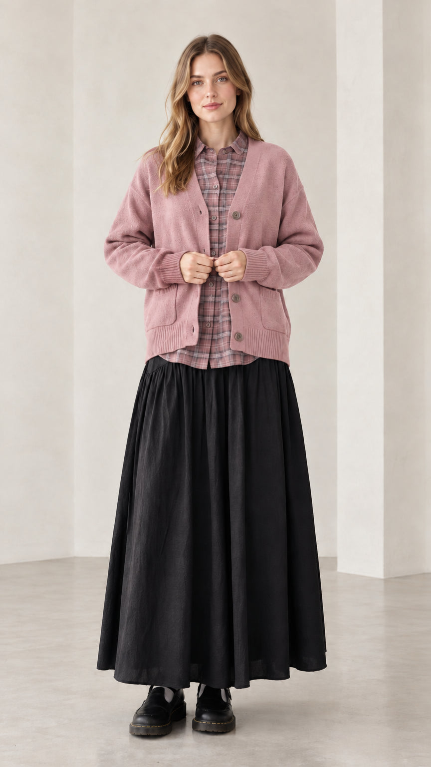 Front view of woman wearing dusty rose pink V-neck button-front knit cardigan sweater