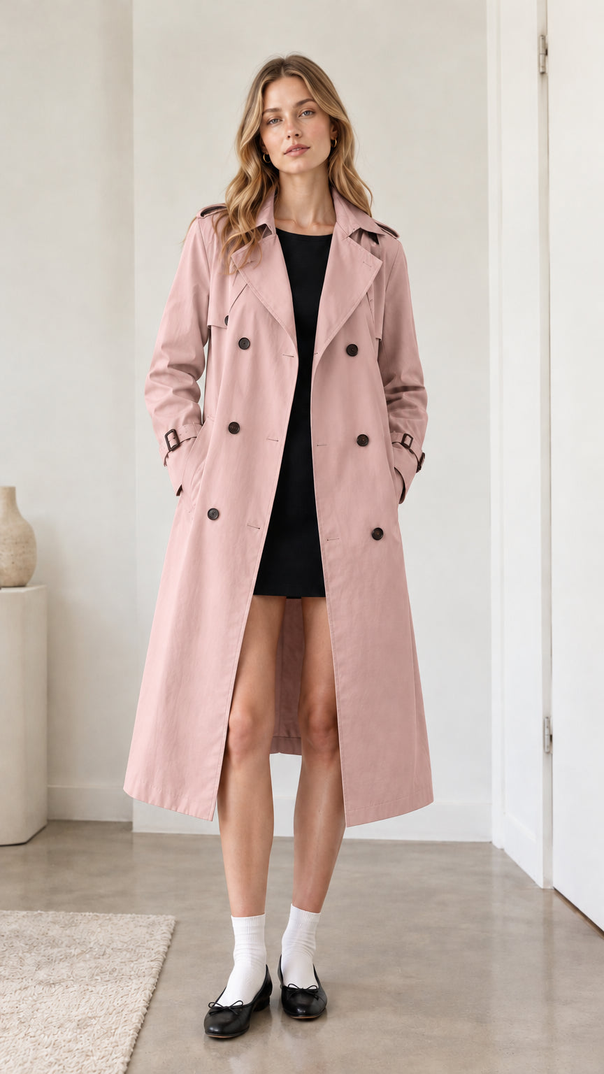 Full front view of model wearing dusty pink double-breasted trench coat