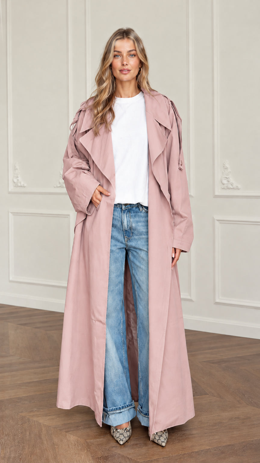 Front view of woman wearing dusty pink maxi duster trench coat