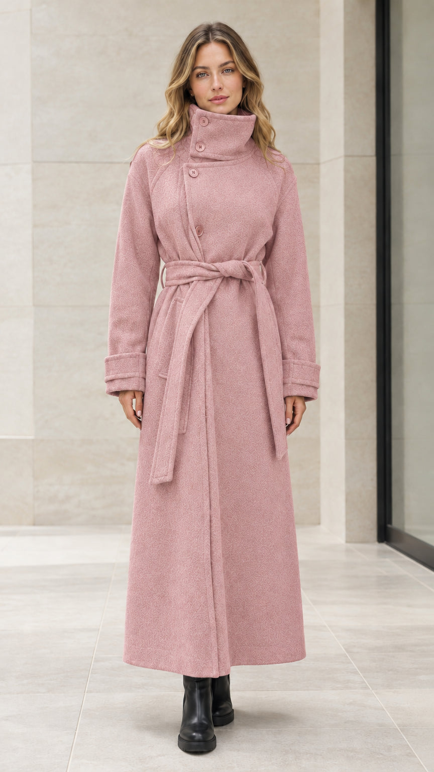 Front view of woman wearing dusty pink high neck belted maxi overcoat