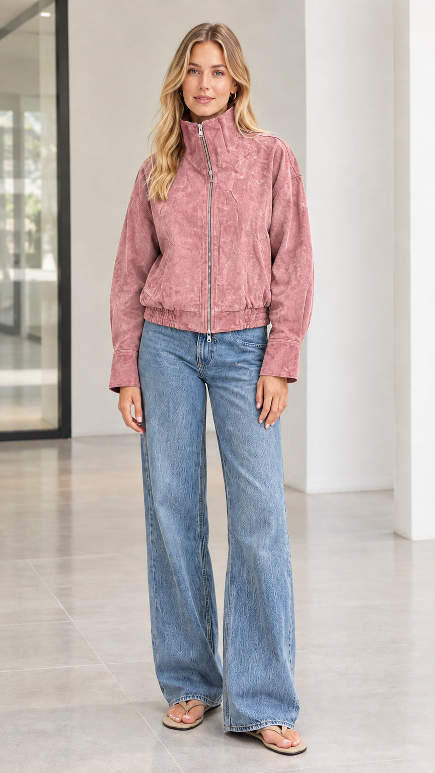 Woman wearing dusty rose pink textured corduroy zip bomber jacket