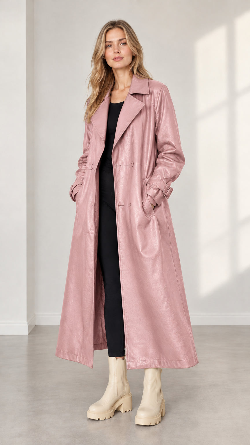 Model wearing dusty pink faux leather maxi trench coat
