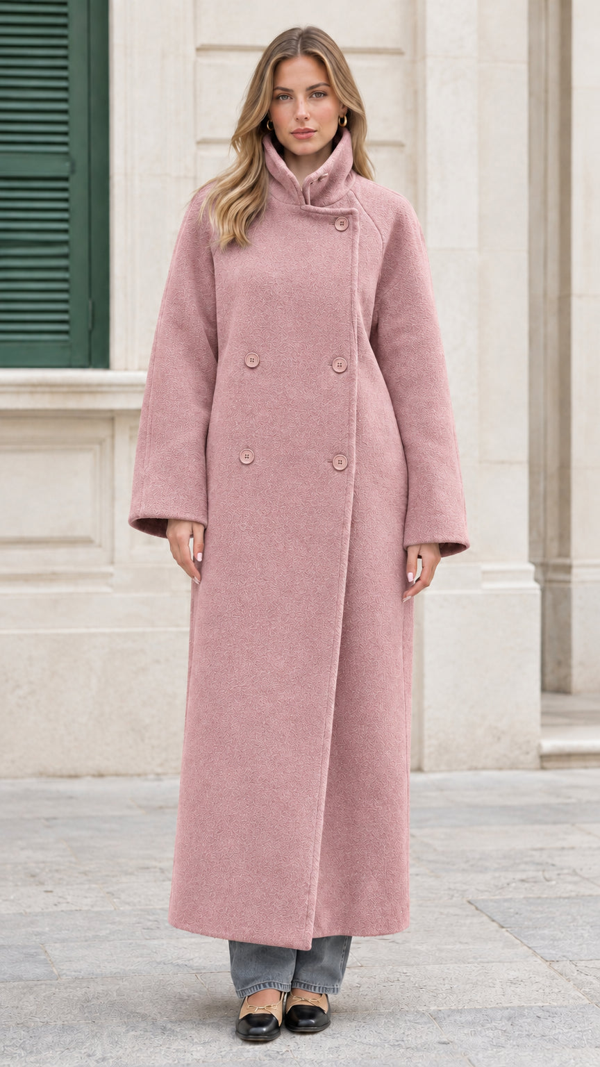 Front view of the dusty pink double-breasted maxi overcoat on model