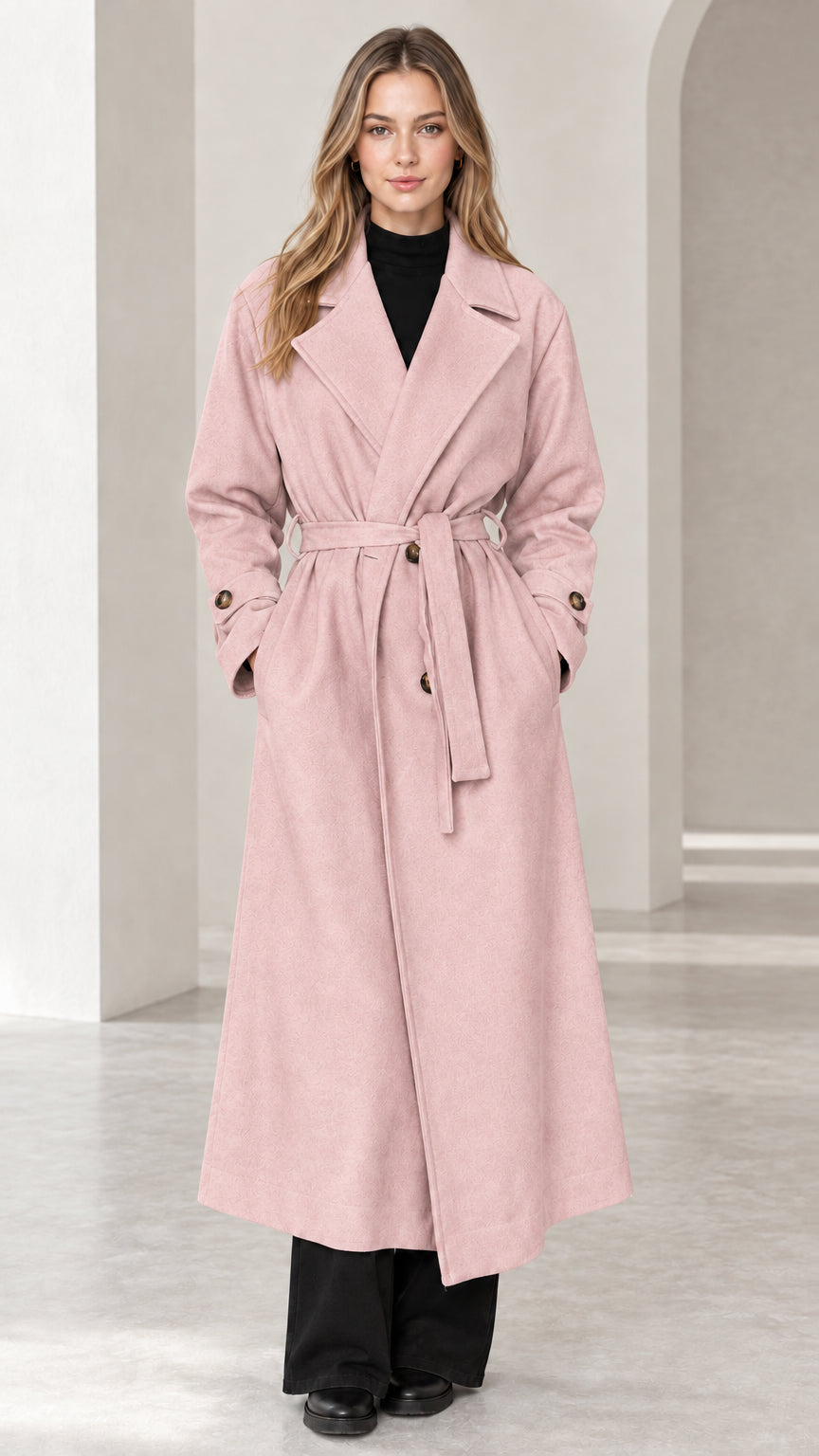 Front view of woman wearing blush pink long belted trench overcoat