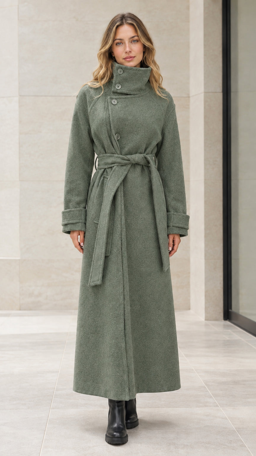 Front view of woman wearing sage green high neck belted maxi overcoat