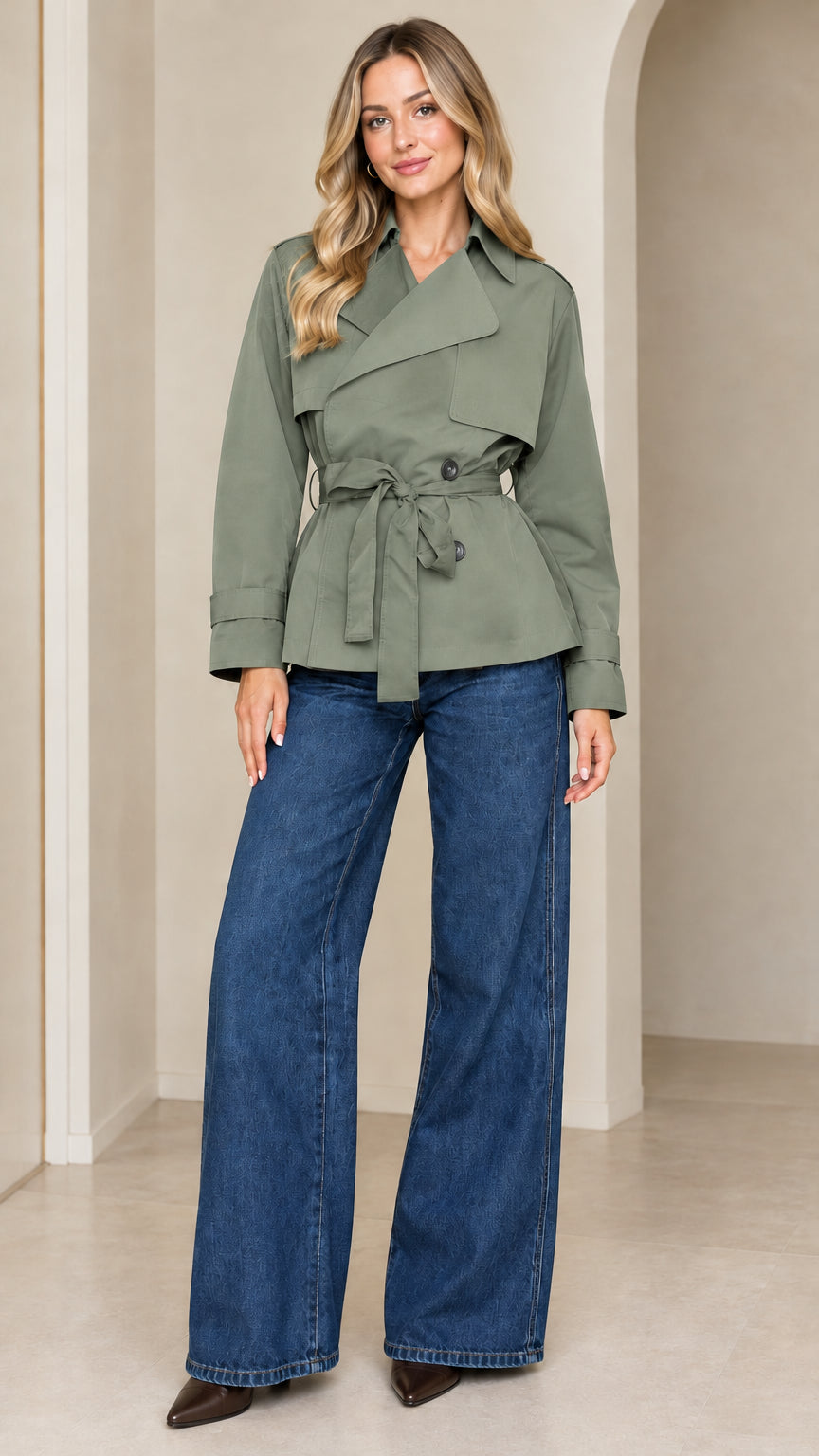 Front view of model wearing the cropped belted trench jacket in sage green